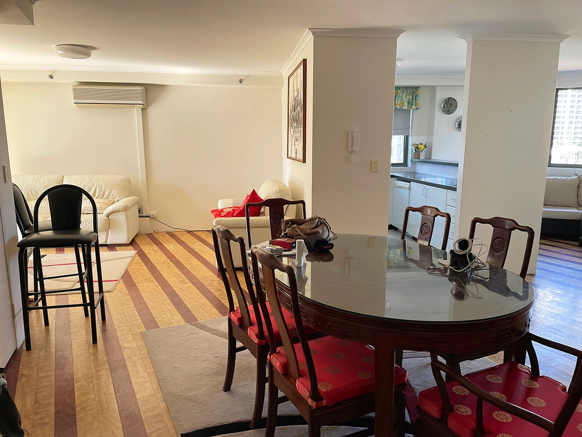Apartment interior before renovation showing original dated finishes and layout